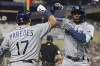 Tampa Bay Rays' Vidal Brujan, left, celebrates with teammate Isaac Paredes (17) after scoring on his home run during the seventh inning of a baseball game Friday, June 10, 2022, in Minneapolis. (AP Photo/Stacy Bengs)