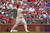 St. Louis Cardinals' Tyler O'Neill hits a sacrifice fly to score Tommy Edman during the sixth inning of a baseball game against the Cincinnati Reds Saturday, June 11, 2022, in St. Louis. (AP Photo/Jeff Roberson)