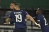 France's Kylian Mbappe, left, celebrates after scoring his team's first goal with Karim Benzema, centre, and Moussa Diaby during the UEFA Nations League soccer match between between Austria and France at the Ernst Happel Stadion in Vienna, Austria, Friday, June 10, 2022. (AP Photo/Michael Gruber)
