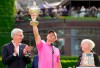 Golf Canada president Liz Hoffman, right, and RBC president David I. McKay look on as Rory McIlroy of Northern Ireland raises the trophy after winning the final round of the Canadian Open in Toronto on Sunday, June 12, 2022. THE CANADIAN PRESS/Frank Gunn