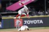Boston Red Sox second baseman Trevor Story, top, leaps for the throw as Seattle Mariners' Dylan Moore, bottom, steals second during the seventh inning of a baseball game, Sunday, June 12, 2022, in Seattle. (AP Photo/John Froschauer)
