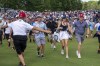 Security officers attempt to restrain fans racing up the 18th fairway behind winner Rory McIlroy in the final round of the Canadian Open in Toronto on Sunday, June 12, 2022. The only PGA Tour event in Canada, was held for the first time after a three-year layoff last Thursday.THE CANADIAN PRESS/Frank Gunn