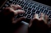 A woman uses her computer keyboard to type while surfing the internet in North Vancouver, B.C., Wednesday, Dec. 19, 2012. Businesses and other private-sector organizations would be required to report ransomware incidents and other cyberattacks to the government under a federal bill to be tabled today. THE CANADIAN PRESS/Jonathan Hayward