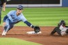 Baltimore Orioles shortstop Jorge Mateo (3) steals second base on a late throw to Toronto Blue Jays' Cavan Biggio (8) during the fifth inning AL MLB baseball action in Toronto on Tuesday, June 14, 2022. THE CANADIAN PRESS/Christopher Katsarov