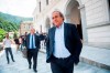 The former president of the the European Football Association (Uefa) Michel Platini, center, is leaving the Swiss Federal Criminal Court in Bellinzona, Switzerland, after the first day of his trial, Wednesday, June 8, 2022. Platini and the former president of the World Football Association (Fifa), Joseph Blatter, stand trial before the Federal Criminal Court from Wednesday, over a suspicious two-million payment. The Federal Prosecutor's Office accuses them of fraud. The defense speaks of a conspiracy. (Ti-Press/Alessandro Crinari/Keystone via AP)