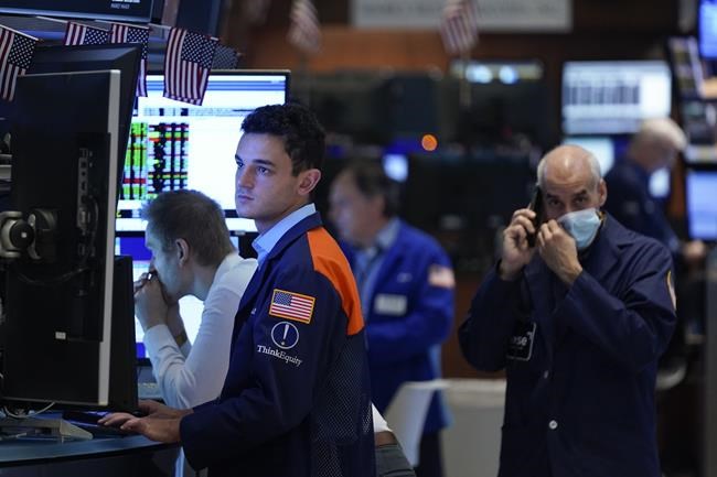 Traders work on the floor at the New York Stock Exchange in New York, Wednesday, June 15, 2022. U.S. stocks are rallying Wednesday and are on track for their first gain in six days. But more turbulence may be ahead when the Federal Reserve announces in the afternoon how sharply it's raising interest rates. (AP Photo/Seth Wenig)