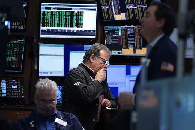 Traders work on the floor at the New York Stock Exchange in New York, Wednesday, June 15, 2022. U.S. stocks are rallying Wednesday and are on track for their first gain in six days. But more turbulence may be ahead when the Federal Reserve announces in the afternoon how sharply it's raising interest rates. (AP Photo/Seth Wenig)