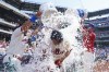 Philadelphia Phillies' Bryson Stott, center, gets doused by his teammates after hitting a three-run home run following the ninth inning of a baseball game against the Miami Marlins, Wednesday, June 15, 2022, in Philadelphia. The Phillies won 3-1. (AP Photo/Chris Szagola)
