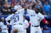 Toronto Blue Jays right fielder Teoscar Hernandez and Vladimir Guerrero Jr. (27) celebrate Hernandez's two run home run driving in Guerrero Jr. during third inning American League MLB baseball action against the Baltimore Orioles in Toronto on Wednesday, June 15, 2022. THE CANADIAN PRESS/Nathan Denette