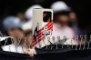 A fan uses a periscope to watch golfers on the driving range during a practice round for the U.S. Open golf tournament at The Country Club, Wednesday, June 15, 2022, in Brookline, Mass. (AP Photo/Charlie Riedel)