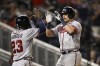 Atlanta Braves' Austin Riley, right, celebrates his two-run home run with Michael Harris II during the eighth inning of the team's baseball game against the Washington Nationals, Wednesday, June 15, 2022, in Washington. The Braves won 8-2. (AP Photo/Nick Wass)