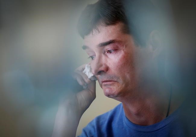 JOHN WOODS / THE CANADIAN PRESSDerek Lints wipes away tears as he speaks about his son Daniel, 17, at his home in Pilot Mound, Man., on Wednesday. Daniel Lints was sexually exploited online in February and committed suicide as a result.