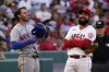 New York Mets' Jeff McNeil, left, chats with Los Angeles Angels third baseman Anthony Rendon during the first inning of a baseball game Friday, June 10, 2022, in Anaheim, Calif. (AP Photo/Mark J. Terrill)