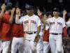 Boston Red Sox's Rafael Devers is congratulated by teammates following the team's win over the St. Louis Cardinals in a baseball game at Fenway Park, Friday, June 17, 2022, in Boston. (AP Photo/Mary Schwalm)