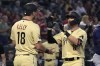 Arizona Diamondbacks' Jordan Luplow celebrates with teammate Carson Kelly (18) after hitting a two-run home run against the Minnesota Twins in the first inning during a baseball game, Friday, June 17, 2022, in Phoenix. (AP Photo/Rick Scuteri)