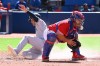 New York Yankees shortstop Isiah Kiner-Falefa, left, slides safely into home ahead of a tag by Toronto Blue Jays catcher Alejandro Kirk after a three-RBI double by Aaron Hicks in fourth inning American League baseball action in Toronto on Saturday, June 18, 2022. THE CANADIAN PRESS/Jon Blacker