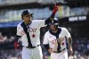 Detroit Tigers' Javier Baez, left, celebrates his two-run home run with Eric Haase against the Texas Rangers in the first inning of a baseball game in Detroit, Saturday, June 18, 2022. (AP Photo/Paul Sancya)