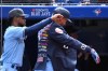 Toronto Blue Jays’ centre-fielder George Springer, right, receives the home run jacket from Otto Lopez, left, after hitting a solo home run against the New York Yankees batter in fifth inning American League baseball action in Toronto on Sunday, June 19, 2022. THE CANADIAN PRESS/Jon Blacker