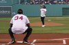 Former Boston Red Sox's Manny Ramirez, right, throws a ceremonial first pitch to former teammate David Ortiz (34) during a pre-game ceremony held to present Ramirez with his Boston Red Sox Hall of Fame plaque before a baseball game against the Detroit Tigers, Monday, June 20, 2022, in Boston. (AP Photo/Steven Senne)