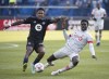 CF Montreal's Romell Quito, left, challenges Toronto FC's Noble Okello during second half Canadian Championship soccer action in Montreal, Sunday, Nov. 21, 2021. The Toronto and Montreal MLS soccer squads will play Wednesday night in Toronto in the Canadian Championship semifinals, with the winner earning a berth in Voyageurs Cup final. THE CANADIAN PRESS/Graham Hughes