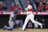 Los Angeles Angels' Taylor Ward (3) crosses home plate after hitting a home run during the third inning of a baseball game against the Kansas City Royals in Anaheim, Calif., Monday, June 20, 2022. (AP Photo/Ashley Landis)