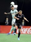 Atlanta United defender Franco Ibarra, left, gets a header against Inter Miami midfielder Bryce Duke during an MLS soccer match Sunday, June 19, 2022, in Atlanta. (Curtis Compton/Atlanta Journal-Constitution via AP)