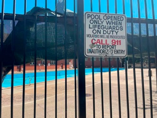 The empty pool at the Hamlin Park Pool remains closed to swimmers in Chicago, Thursday, June 16, 2022. Chicago's public pools will remain closed until July 5, 2022, according to park superintendent and CEO Rosa Escareño. The city, like the rest of the U.S., is experiencing a critical shortage of lifeguards and is offering $600 retention bonuses to attract new applicants. (AP Photo/Claire Savage)
