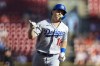Los Angeles Dodgers' Will Smith gestures as runs the bases after hitting a solo home run during the first inning of a baseball game against the Cincinnati Reds in Cincinnati, Tuesday, June 21, 2022. (AP Photo/Aaron Doster)