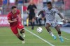CF Montréal forward Romell Quioto (30) controls the ball near the touch-line as Toronto FC defender Shane O'Neill (27) gives chase during first half Voyageurs Cup semifinal soccer action in Toronto on Wednesday, June 22, 2022. THE CANADIAN PRESS/Nathan Denette