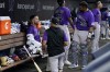 Colorado Rockies starting pitcher Chad Kuhl, left, talks with pitching coach Darryl Scott, center, and catcher Elias Diaz (35) during the fourth inning of a baseball game against the Miami Marlins, Wednesday, June 22, 2022, in Miami. (AP Photo/Lynne Sladky)
