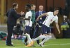 England's coach Gareth Southgate, left, shakes hands with England's Bukayo Saka as he is substituted during the UEFA Nations League soccer match between England and Hungary at the Molineux stadium in Wolverhampton, England, Tuesday, June 14, 2022. (AP Photo/Jon Super)