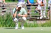 Germany's Martin Kaymer squats on the green during the German International Open golf tournament at Golfclub Muenchen Eichenried in Munich, Germany, Thursday, June 23, 2022. (Christian Kolbert/dpa via AP)