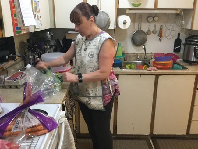 Tara Andrews is seen at her home in Coquitlam, B.C., in this handout image provided June 23, 2022. Skipping the occasional meal has become the norm for Tara Andrews, who says soaring grocery prices have made it too hard to adequately feed herself and her two teens. Even with help from food donations and a charity, the 49-year-old single mom says the skyrocketing cost of living is more than she can handle. THE CANADIAN PRESS/HO-Tara Andrews  **MANDATORY CREDIT**