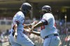 Minnesota Twins' Nick Gordon, left, celebrates with third base coach Tommy Watkins after hitting a solo home run against Cleveland Guardians pitcher Zach Plesac during the third inning of a baseball game, Thursday, June 23, 2022, in Minneapolis. (AP Photo/Craig Lassig)