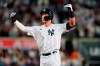 New York Yankees' Aaron Judge gestures to teammates after hitting a single to drive in the winning run during the ninth inning of the team's baseball game against the Houston Astros on Thursday, June 23, 2022, in New York. (AP Photo/Frank Franklin II)