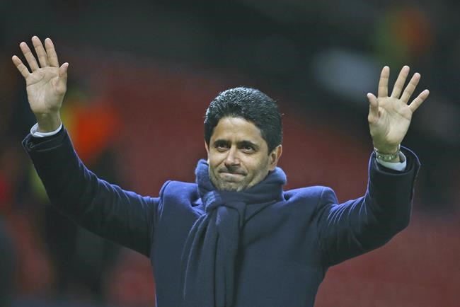 FILE - Paris Saint Germain owner Nasser bin Ghanim Al-Khelaifi waves to his teams fans after the end of the Champions League round of 16 soccer match between Manchester United and Paris Saint Germain at Old Trafford stadium in Manchester, England, Tuesday, Feb. 12, 2019. Nasser al-Khelaïfi was acquitted Friday, June 24, 2022, for a second time by Swiss federal judges in a retrial of alleged wrongdoing linked to former FIFA secretary general Jérôme Valcke. (AP Photo/Dave Thompson, File)