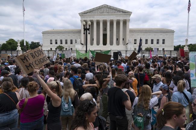 Abortion-rights protesters gather outside the Supreme Court in Washington, Friday, June 24, 2022. The Supreme Court has ended constitutional protections for abortion that had been in place nearly 50 years, a decision by its conservative majority to overturn the court's landmark abortion cases. (AP Photo/Jose Luis Magana)