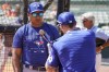 Toronto Blue Jays hitting coach Guillermo Martinez, left, works with catcher Tyler Heineman prior to the start of the Blue Jays at Baltimore Orioles spring training baseball game at Ed Smith Stadium on Friday March 18, 2022, in Sarasota, Fla. Major League Baseball has suspended  Martinez five games and fined him an undisclosed amount for after his heated argument with umpire Doug Eddings before a game Wednesday. THE CANADIAN PRESS/AP-Steve Helber