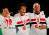 FILE - Brazil's Sao Paulo midfielder Richarlyson, center, celebrate with teammates their gold medals after winning the FIFA Club World Championship Toyota Cup title in Yokohama, near Tokyo, Dec. 18, 2005. The former Brazil and Sao Paulo midfielder said in a podcast on Friday, June 24, 2022, that he is bisexual. (AP Photo/Shizuo Kambayashi)