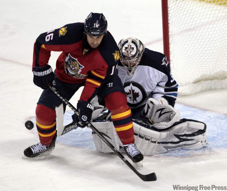 Alan Diaz / The Associated Press
Winnipeg Jets goalie Ondrej Pavelec (31) blocks a shot by Florida Panthers' Marco Sturm (16) in the second period of an NHL hockey game in Sunrise, Fla., Monday.
