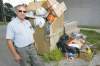 COLE BREILAND / WINNIPEG FREE PRESS
'We're like a Third World country in the North End now. The city should be picking it up. I don't care if they're removing them, the bin is full' -- Rick Negrych.