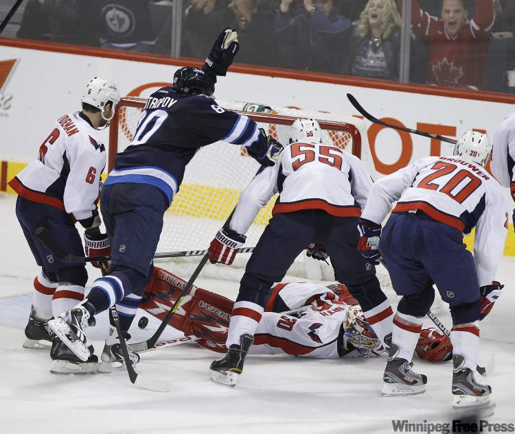 Trevor Hagan / The Canadian Press
Winnipeg Jets' Nik Antropov (80) celebrates after they scored on Washington Capitals' Michal Neuvirth (30) during second-period action at MTS Centre in Winnipeg Thursday.