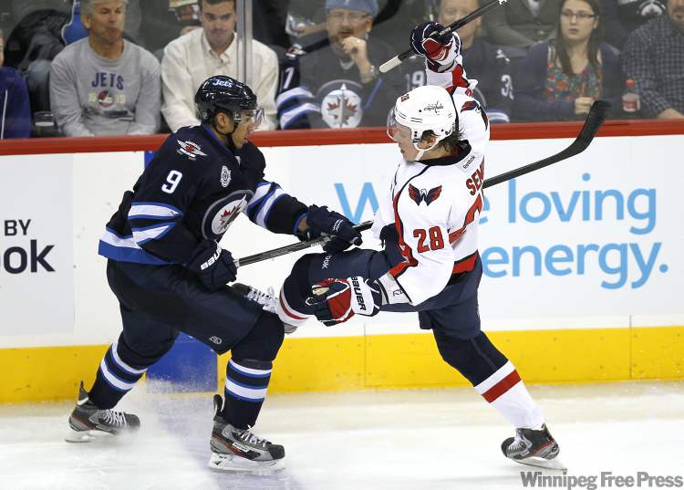 John Woods / Winnipeg Free Press
Winnipeg Jets' forward Evander Kane (9) takes out Washington Capitals' forward Alexander Semin (28) during third period NHL action in Winnipeg on Thursday.