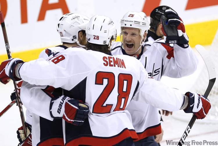 John Woods / Winnipeg Free Press
Washington Capitals' forward Brooks Laich (21), forward Alexander Semin (28) and forward Jason Chimera (25) celebrate Semin's goal against the Winnipeg Jets during first period NHL action in Winnipeg on Thursday.