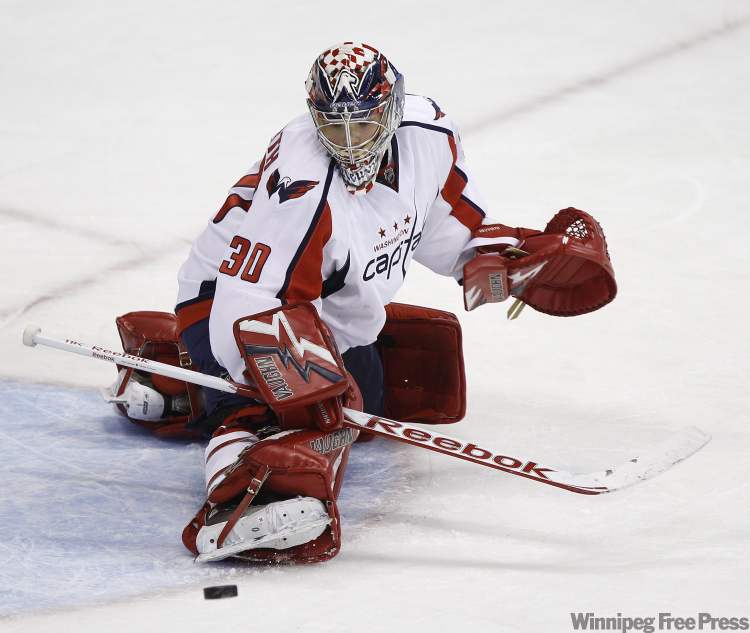 Trevor Hagan / The Canadian Press
Washington Capitals' Michal Neuvirth (30) makes a pad save during a short-handed opportunity by the Winnipeg Jets during first period NHL action at MTS Centre in Winnipeg Thursday.