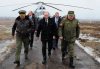 Associated Press photo / RIA-Novosti, Mikhail Klimentyev, Presidential Press Service
Russian President Vladimir Putin, centre, along with Defense Minister Sergei Shoigu, left, and the commander of the Western Military District Anatoly Sidorov, right, walk upon arrival to watch a military exercise near St.Petersburg, Russia on Monday, March 3, 2014. Putin sought and received Russian parliament's permission to use the Russian military in Ukraine.