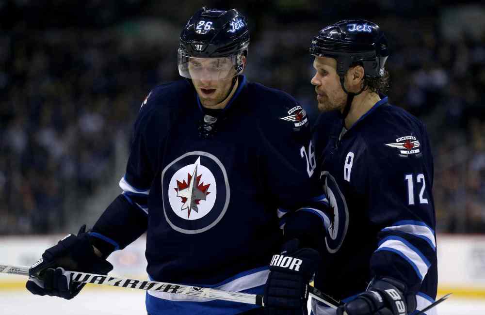 Trevor Hagan / Winnipeg Free Press
Winnipeg Jets' Blake Wheeler (26) and Olli Jokinen (12) skate together during second period hockey action against the Columbus Blue Jackets' at MTS Centre Saturday.