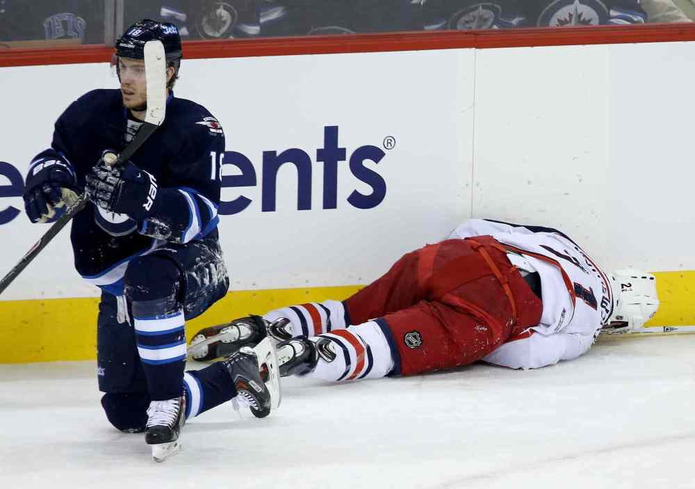 Trevor Hagan / Winnipeg Free Press
Winnipeg Jets' Bryan Little (18) and Columbus Blue Jackets' James Wisniewski (21) collided during the first period of Saturday's game.