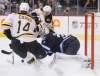 Trevor Hagan / The Canadian Press
Winnipeg Jets goaltender Ondrej Pavelec (31) stops the puck between Boston Bruins' Joe Corvo (14) and Brad Marchand (63) during first-period NHL hockey action in Winnipeg on Friday.