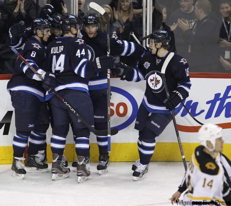 Trevor Hagan / The Canadian Press
Winnipeg Jets' celebrate after Andrew Ladd (16) opened the scoring against the Boston Bruins during first period NHL action in Winnipeg Tuesday.